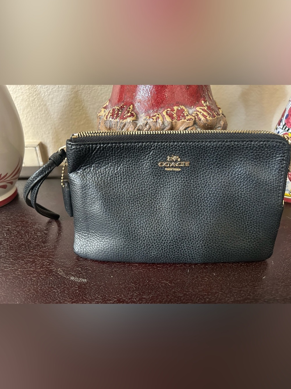 Coach Black Pebbled Leather wristlet with Gold Logo